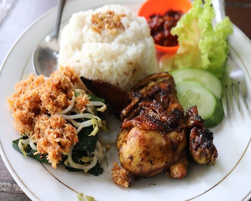 A balanced portion of Indonesian home-cooked meal with rice and fresh vegetables